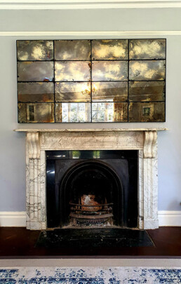 Antique mirror glass feature wall mirror for a living room in a private residence in Ireland.